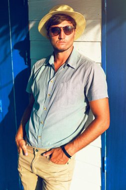 stylish guy posing at sunny day