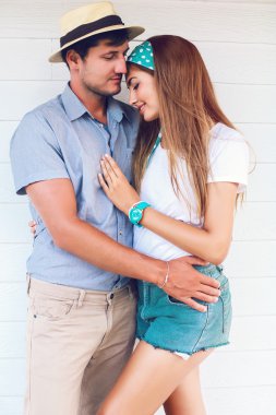 hipster couple in love hugs