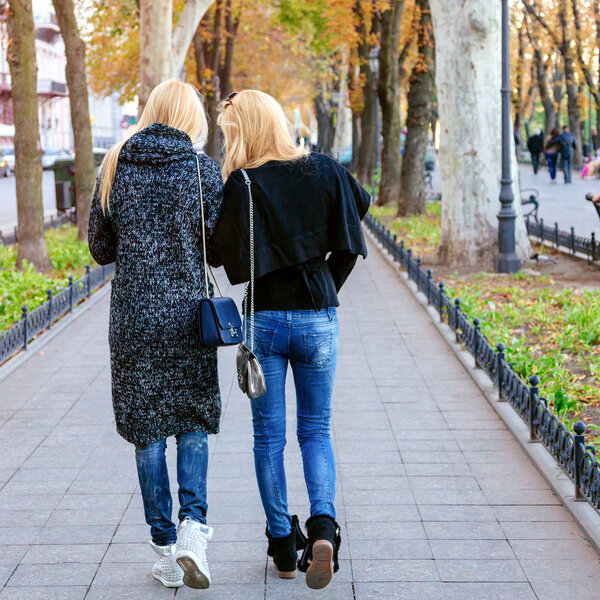 Two girls walking on the street