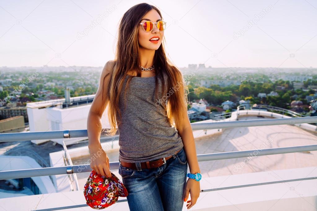 stylish girl posing at the roof