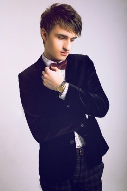 handsome man posing at elegant suit