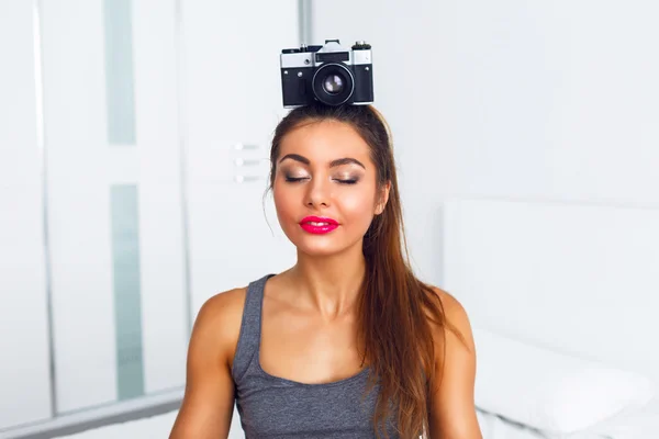 Girl meditate with vintage camera — Stok fotoğraf