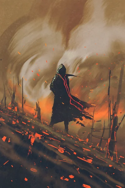 Uomo in mantello nero in piedi contro la foresta in fiamme — Foto Stock