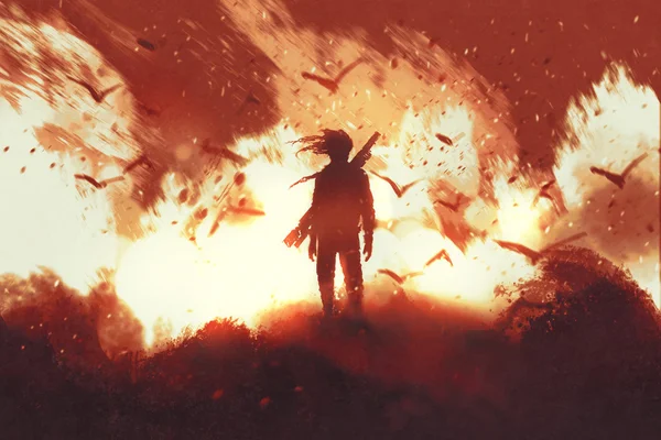 Человек с ружьем на фоне огня — стоковое фото