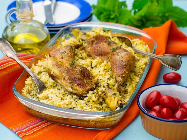 Chicken legs with saffron rice and spices — Stock Photo, Image
