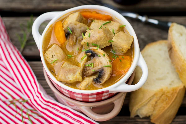 Pork stew with carrots and mushrooms in gravy — Stock Photo, Image