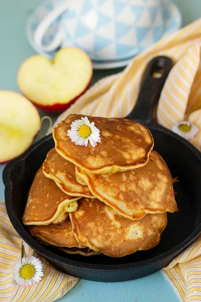 Homemade sweet apple pancakes with grated apples and cinnamon for tea