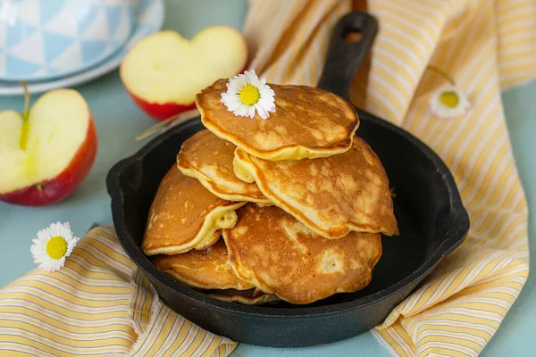 Homemade sweet apple pancakes with grated apples and cinnamon for tea