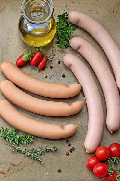Sausages with olive oil and herbs — Stock Photo, Image