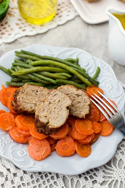 Italian veal meatloaf polpettone with carrots and sauce — Stock Photo, Image