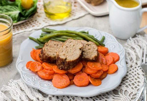 Italian veal meatloaf polpettone with carrots and sauce — Stock Photo, Image