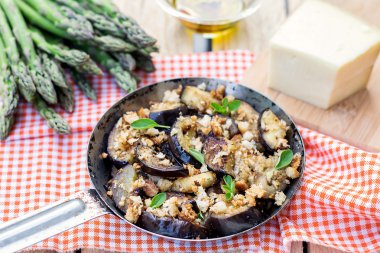 Eggplants aubergines sautéed with breadcrumbs and cheese