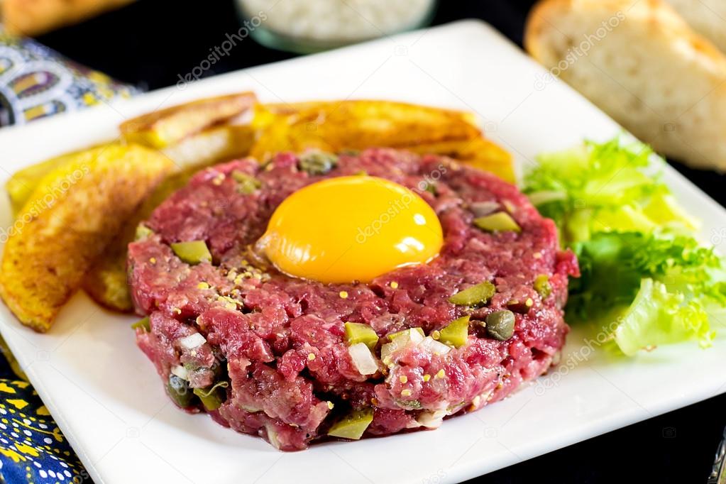 Raw beef steak tartare with French fries