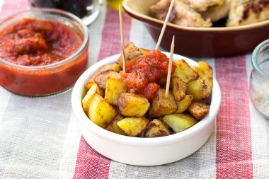 Spanish potatoes patatas bravas for tapas clipart