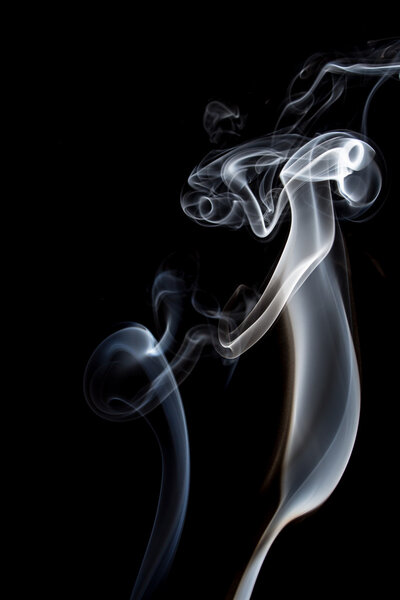 Abstract of smoke dance on a black background.