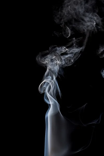 Abstract of smoke dance on a black background.