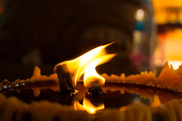 Close up flame large candle in temple — Stock Photo, Image