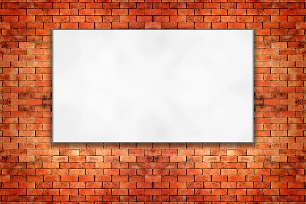 Blank folded paper poster hanging on brick wall