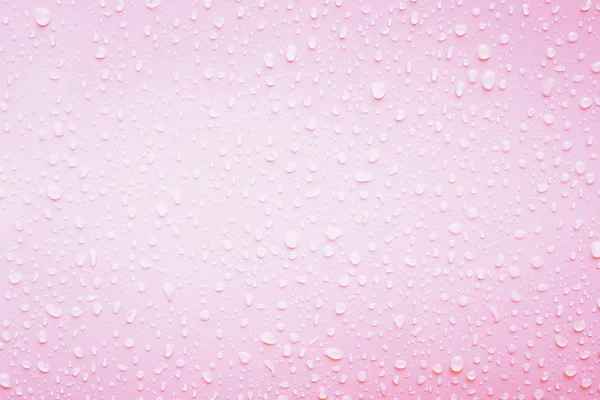 Water drops on pink texture — Stock Photo, Image