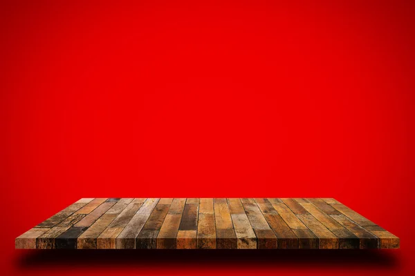 Old wooden shelf on red wall background. — Stock Photo, Image