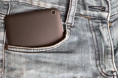Tablet ve kot pantolon
