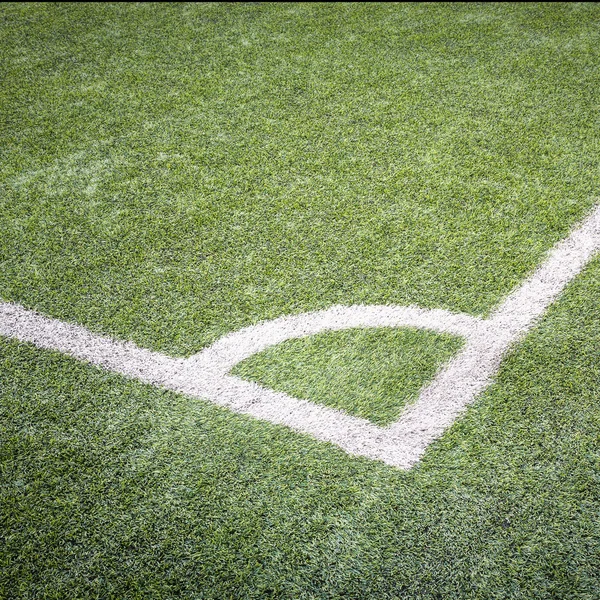 Zelené trávě textury ve fotbalové hřiště — Stock fotografie