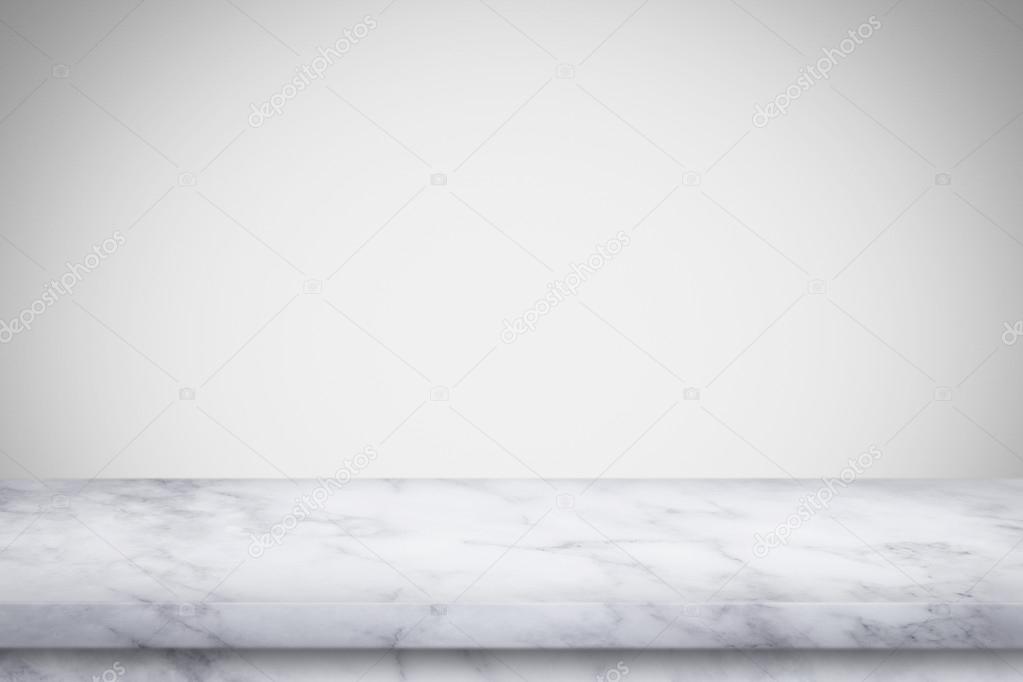 Empty marble table with white gray gradient wall background. 