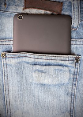 Tablet ve kot pantolon