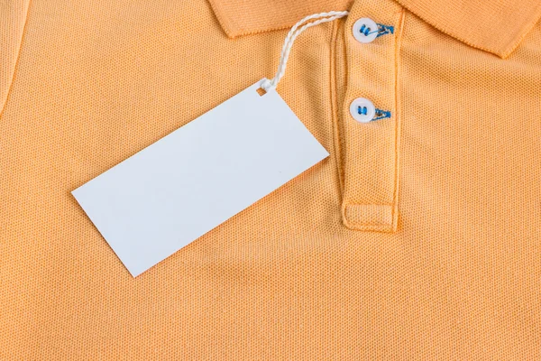 a blank white label or tag attached on shirt