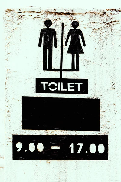 Toilet sign on cement texture — Stock Photo, Image