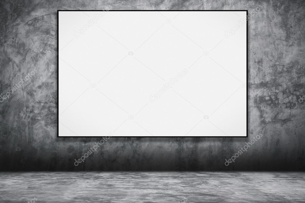 Blank folded paper poster hanging on concrete wall.