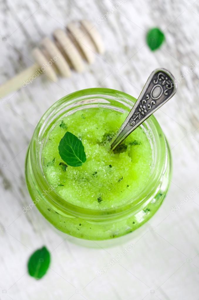 Mint and honey cooling face and body scrub in a small glass jar — Stock