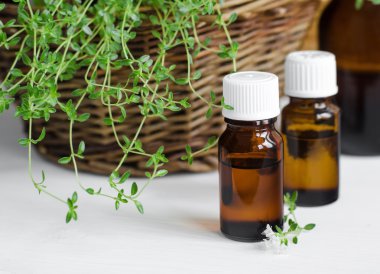 Small bottle of essential thyme oil clipart