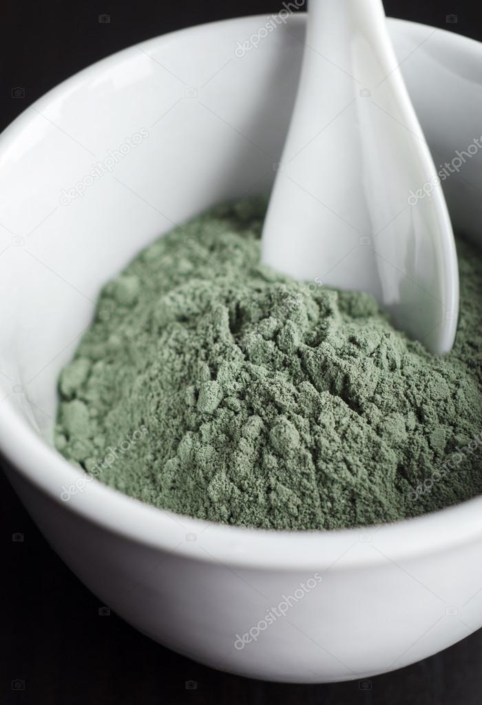 Green cosmetic clay in a bowl