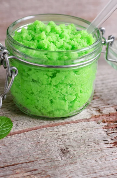 Green scrub in a glass jar — Stock Photo, Image