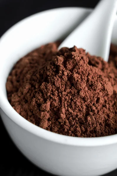 Cocoa powder in a bowl close up — Stock Photo, Image