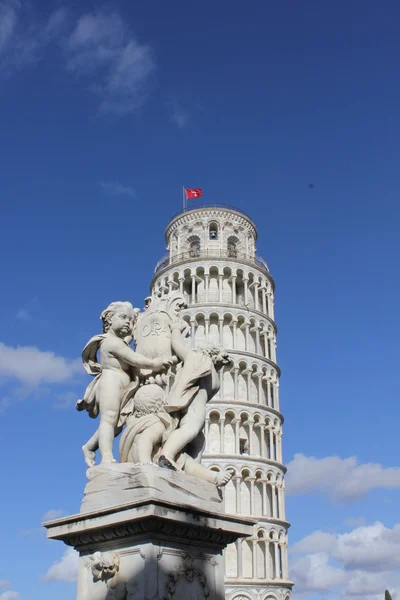 Pisa Leaning tower and angels statue — Stock Photo, Image