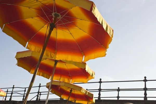 Red and yellow beach umbrellas — Stock Photo, Image