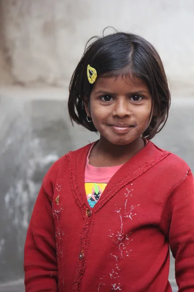 Young Indian girl, red dressed, looking at the camera — Stock Photo, Image