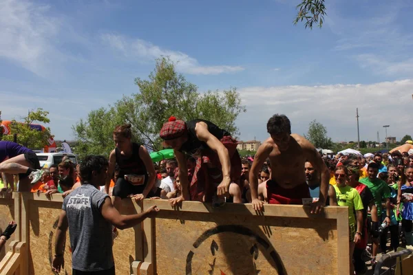 People jumping over an obstacle — Stock Photo, Image