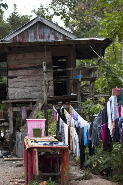 Laundry hang out of an old and poor shed — Zdjęcie stockowe