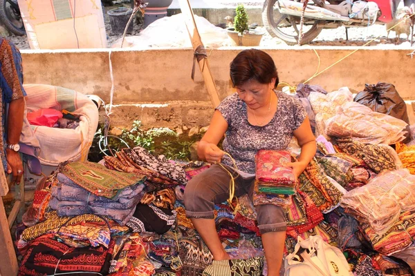 Woman selling textiles — Stok fotoğraf