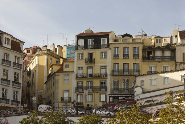 LISBON, PORTUGAL - OCTOBER 24 2014: Buildings in Lisbon, at the beginning of Calcada do Duque, with its traditional slope street