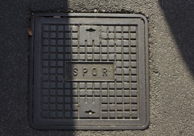 roman manhole with the latin abbreviation SPQR