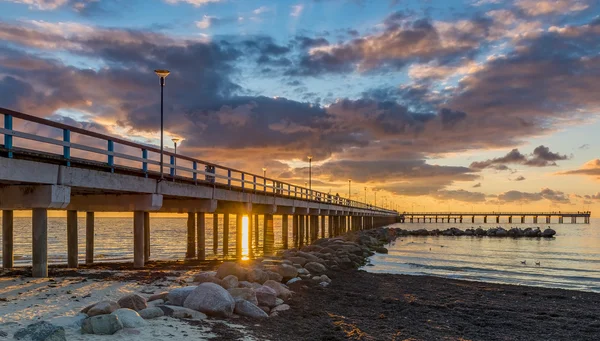 Marine pier in Palanga at sunset, Baltic Sea, Lithuania — Stock Photo, Image