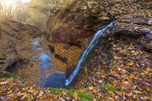 A magical landscape with a waterfall in the autumn forest (harmo — Stock Photo, Image