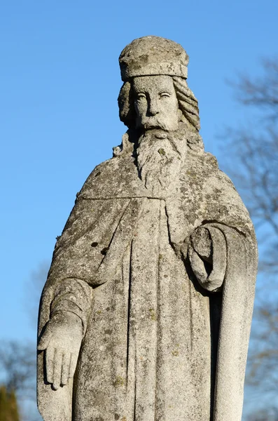 The old stone statue of saint on gravestone in Ukraine — Stock Photo, Image