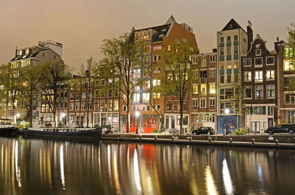 Outdoor landscape with old houses and boats near the canal with — Stock Photo, Image