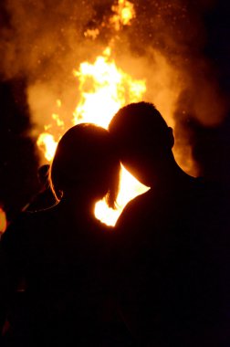 The boy and girl on the background of fire (love, relationships, clipart