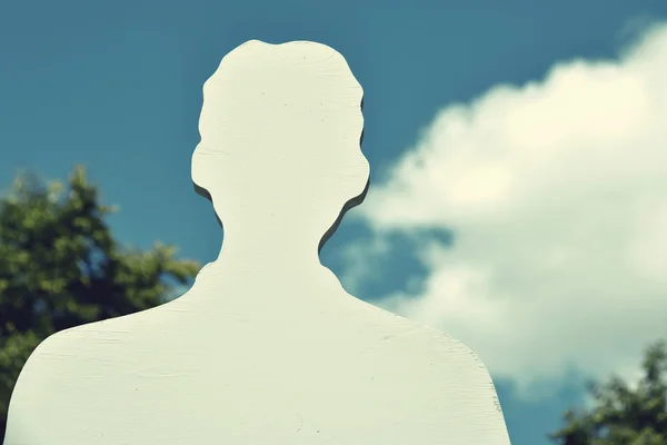 Silhouette of man against the sky with clouds in vintage style ( — Stock Photo, Image